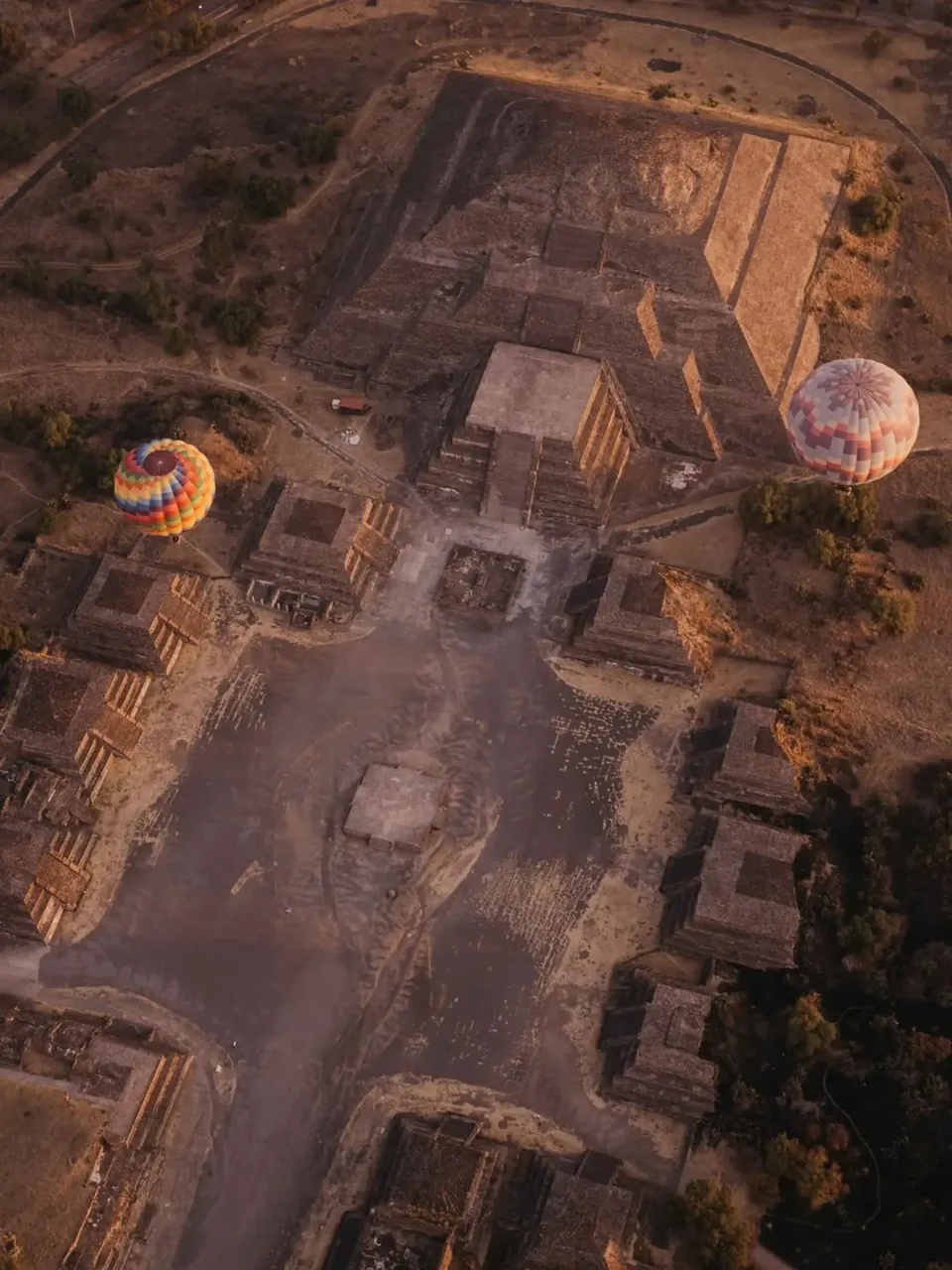 The Teotihuacan archaeological zone seen whole from the air at first light, the Avenue of the Dead crossing the valley