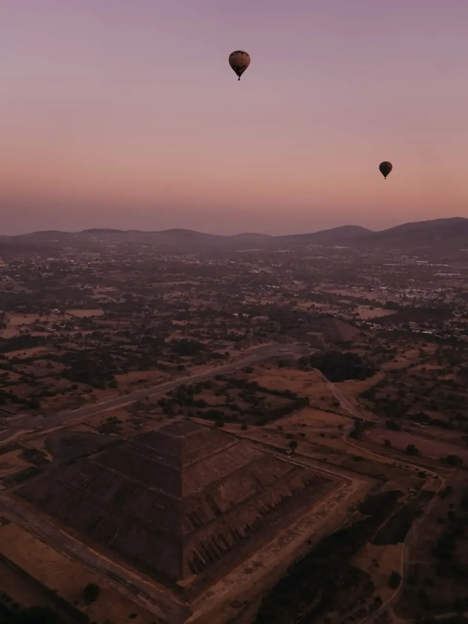 The Pyramid of the Moon and the valley beyond it at dawn