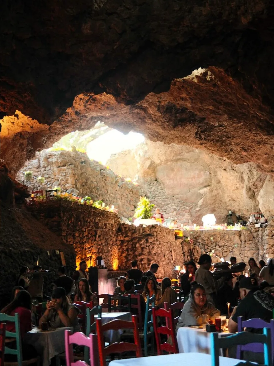 The dining room at La Gruta seen below the natural skylight in the rock roof