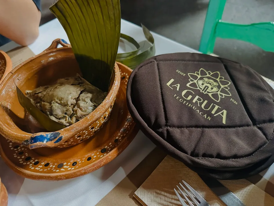 An embroidered tortilla basket bearing the La Gruta Teotihuacan crest